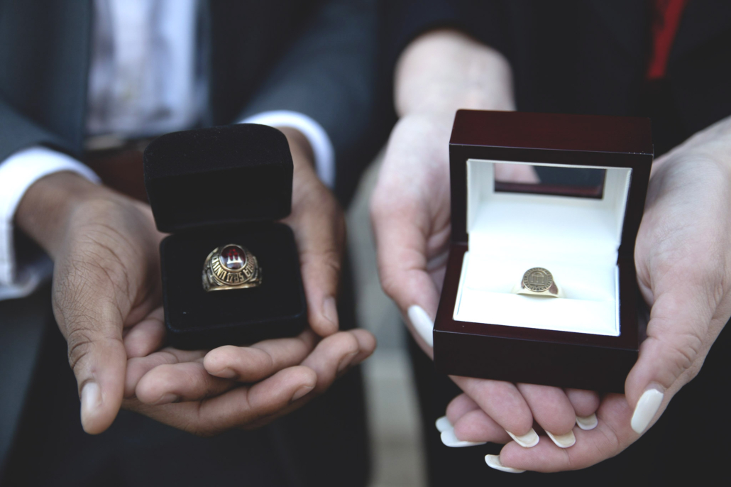  photo of two hands holding UGA rings