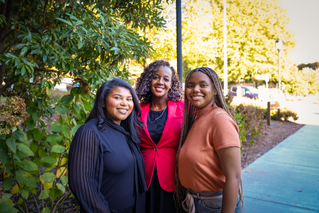 Tia, Rachel and Stevonna pose together at the Terry College of Business.