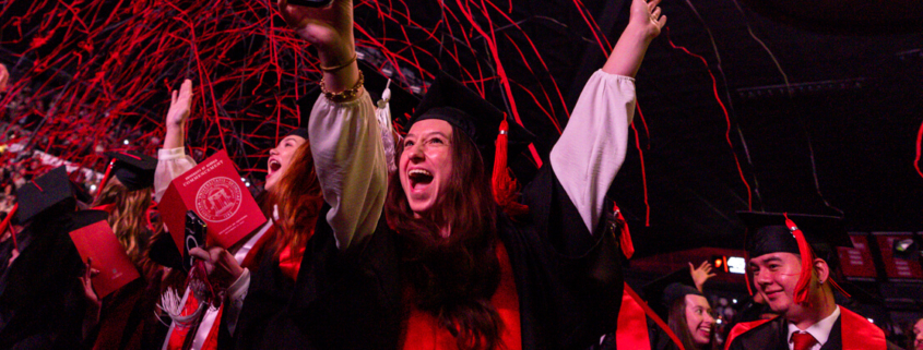 Streamers fall over the crowd during fall 2024 undergraduate commencement at Stegeman Coliseum. (PHOTO: Chamberlain Smith/UGA)