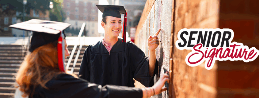 Students find their names on the Senior Signature plaque on campus.