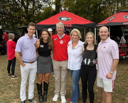 John, Suzanne and their family cheer for the Dawgs.