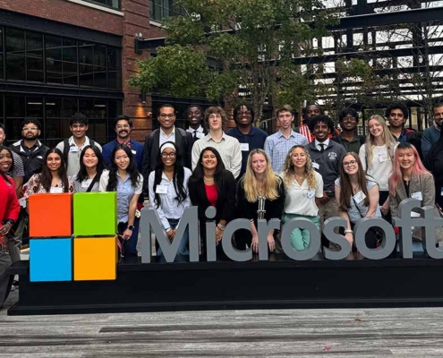 UGA Career Caravan students take photo in front of Microsoft sign