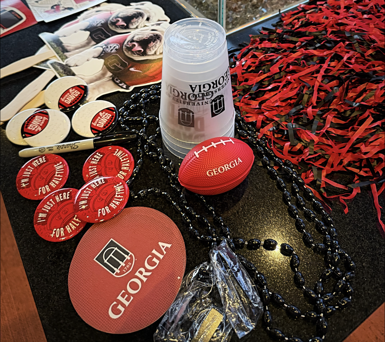 Fun UGA merch that the UGA Atlanta Alumni Chapter has at their game-watching parties.