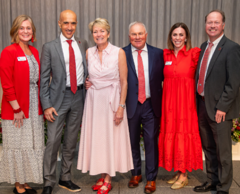 A group of people pictured on a stage in front of a gray backdrop at the 2026 UGA Alumni Awards Luncheon.