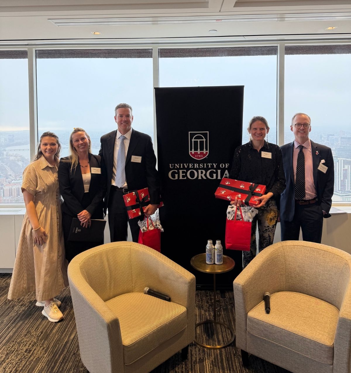 A group photo at the panel event featuring Adam Barb, Seychelle Vos, and Dustin Henderson