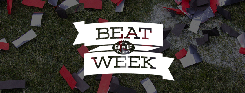 Photo of confetti on football field with Beat Week logo on top
