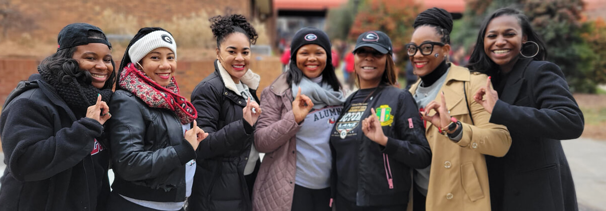 AKA alumnae celebrate the UGA national championship in front of the UGA Bookstore