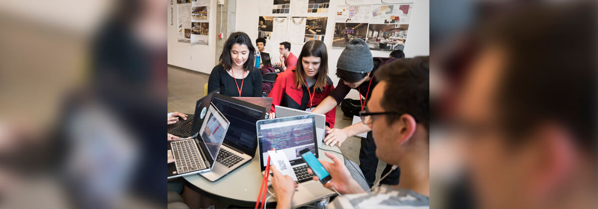 A UGA student group works on computers and phones.