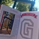 G Book in front of the Arch on UGA's North Campus.