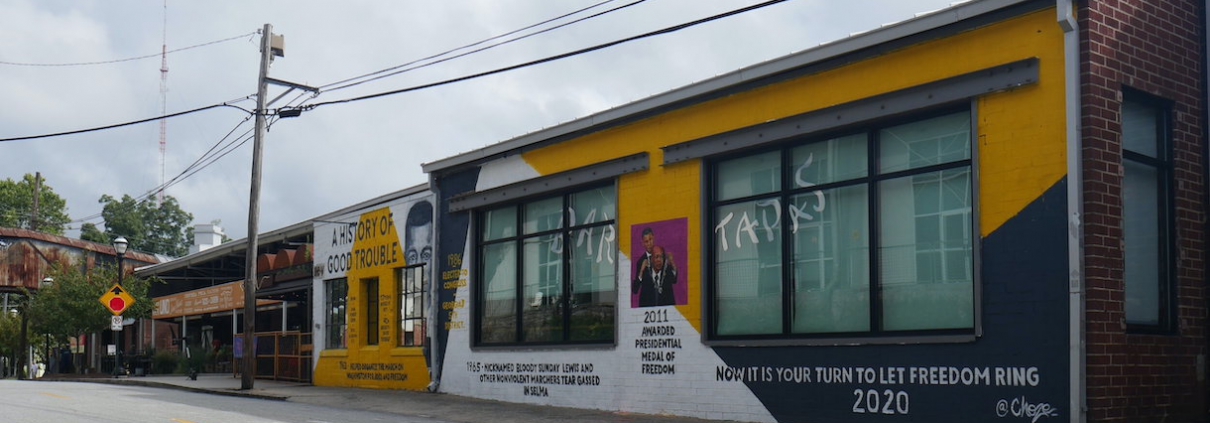 an image of a yellow and white mural featuring John Lewis
