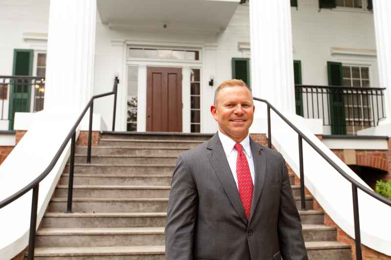 Brian Dill in front of Wray-Nicholson House