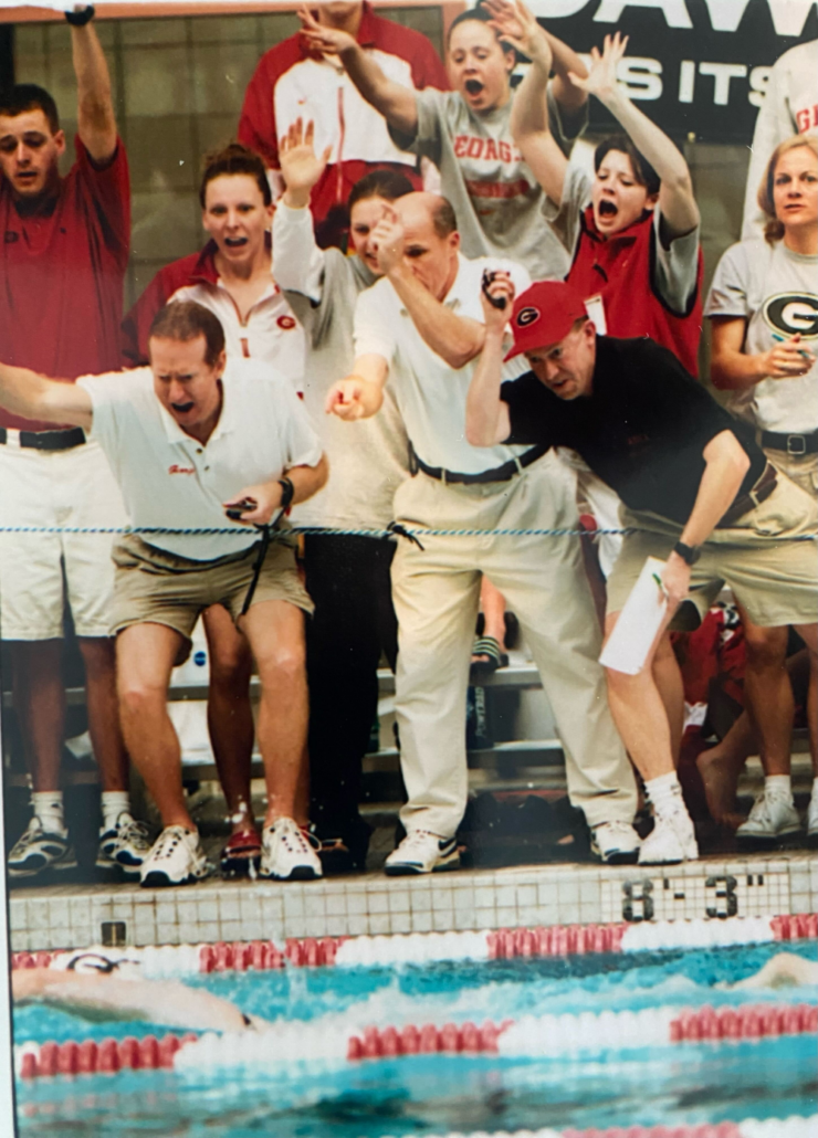 UGA coaches and swimmers cheering