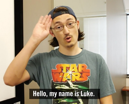Luke signing "Hello"