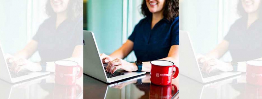 UGA Alumna at laptop