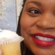 UGA mentor Ansley Booker raises a cupcake in a birthday salute to the UGA Mentor Program
