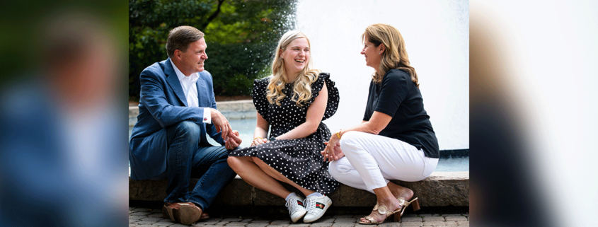 photo of Elizabeth Grace Mitchell and her parents, Jeff and Allison, by the Herty Field fountain