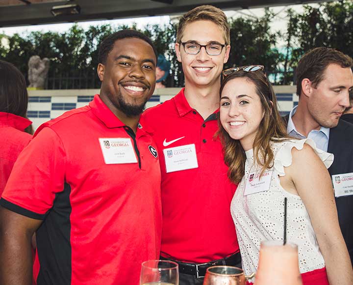 UGA Alumni from Savannah pose for a photo.