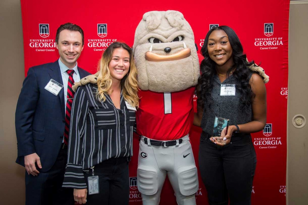 Representatives Aaron Konnick, Samantha Green and Isobel Egbarin from UPS accept the UGA Top 25 Employer Award. (Photo credit: Justin Evans Photography)