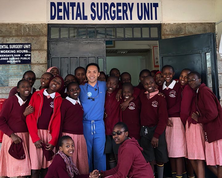 Dr. Vy Do (BS '10) in front of a dental clinic he volunteered his talents at in Kikiyu, Kenya.