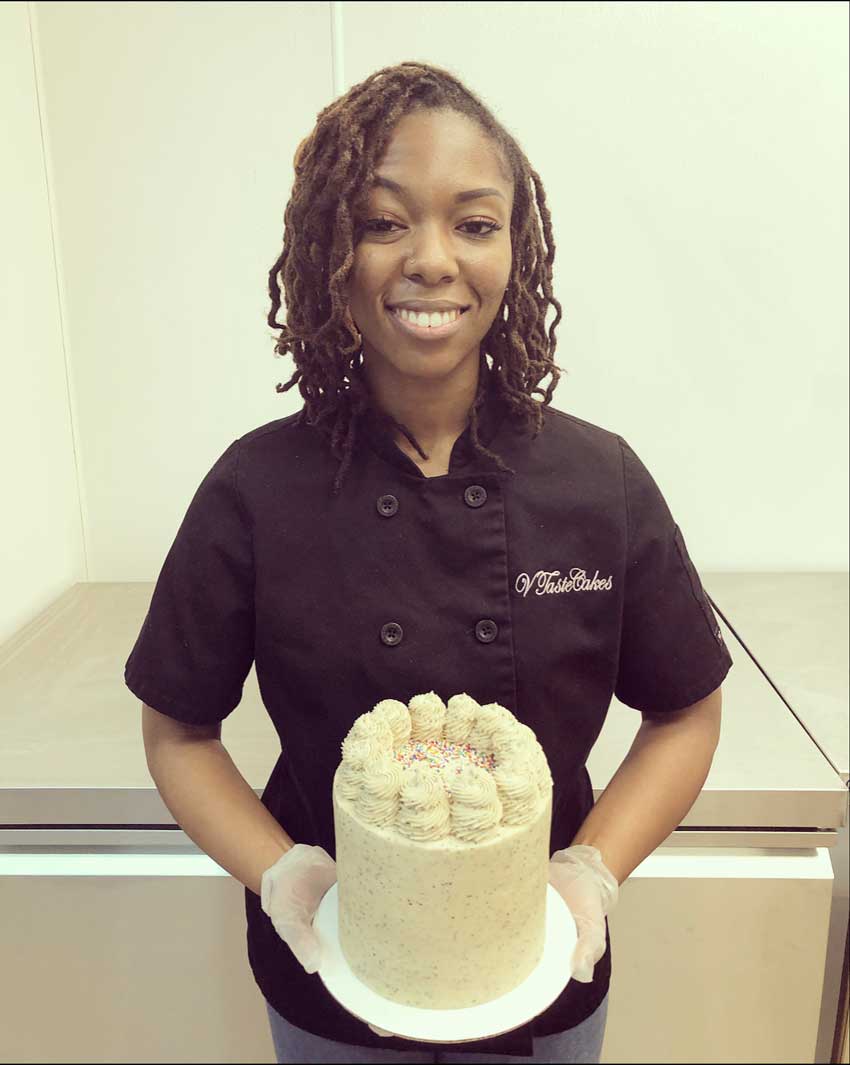 Jasmyn Reddicks holds a cake