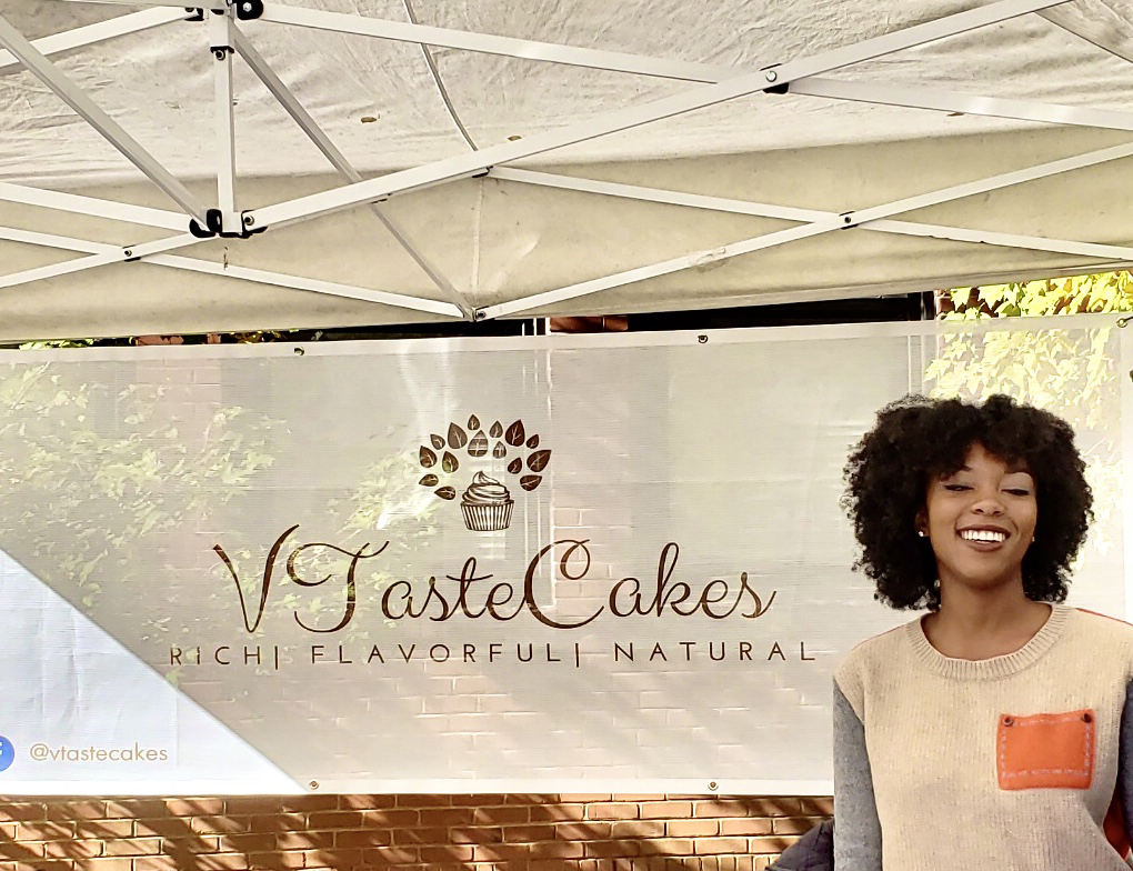 Jasmyn Reddicks in front of a VTasteCakes banner