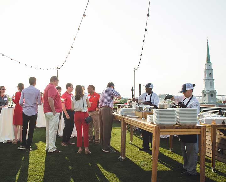 UGA Alumni and friends gather at the Perry Lane Hotel overlooking historic Savannah.